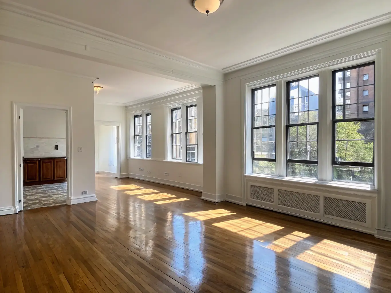 A clean and empty apartment, ready for new tenants, showcasing Cleanup Station LLC's move-in/move-out cleaning service, with attention to detail and spotless surfaces.